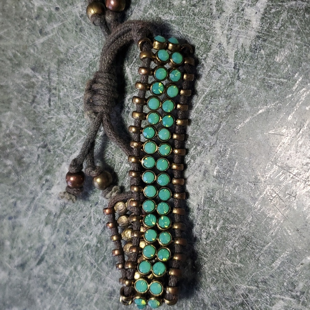 Turquoise and brass draw string bracelet with leather